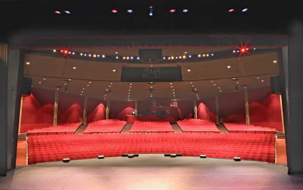 Red seating and the stage inside Redondo Beach Performing Arts Center